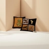 Black background patterned gourd-patterned cushions, brown leather sofa paired with white porcelain coffee cups, plates and booklets Specification image